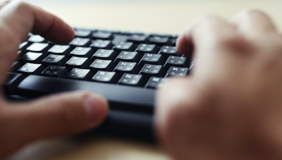 Close up of typing on keyboard